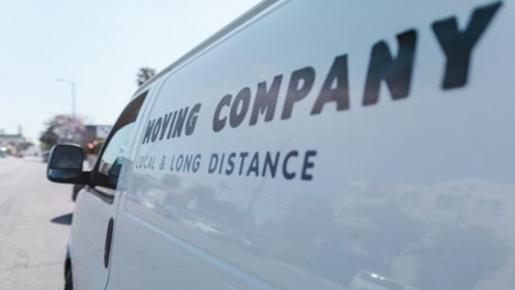 Close-up of a white moving van.