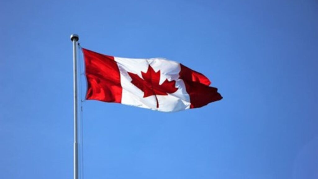 Canadian flag on a pole.